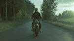 Max (Karol Białas) returns by motorcycle from the edge of the quarantine zone. Still from East (Wschód).